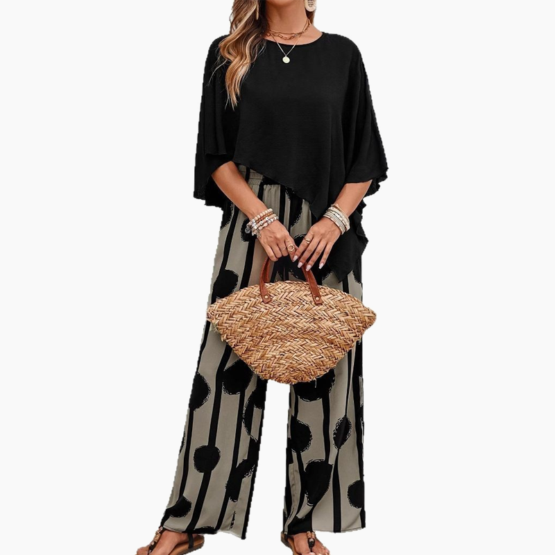 Elegant set with three-quarter sleeve blouse and patterned trousers