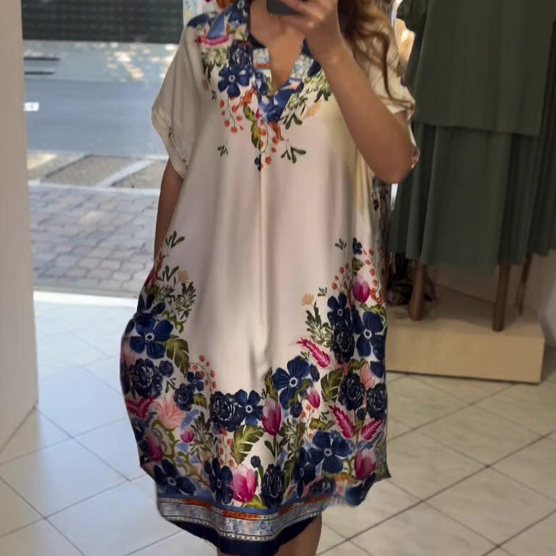 Dress with floral neckline and V neckline