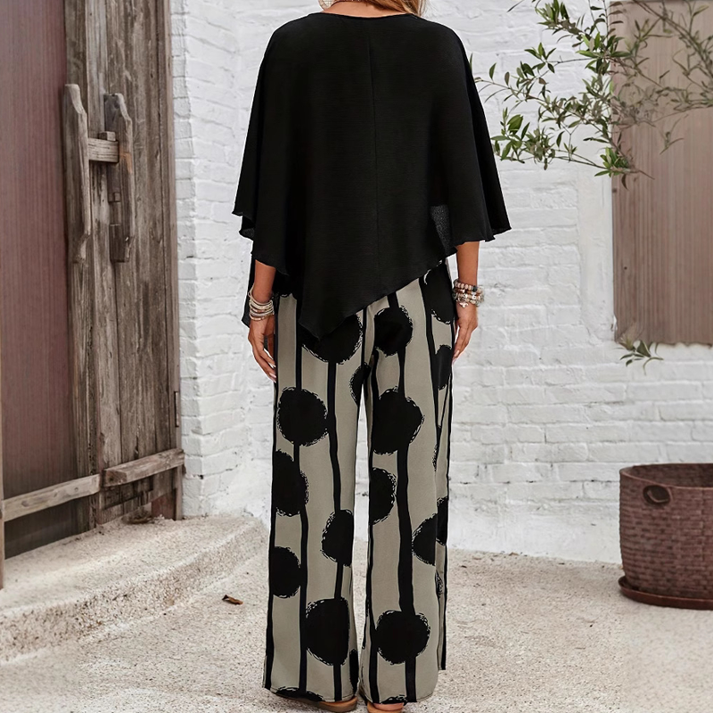 Elegant set with three-quarter sleeve blouse and patterned trousers