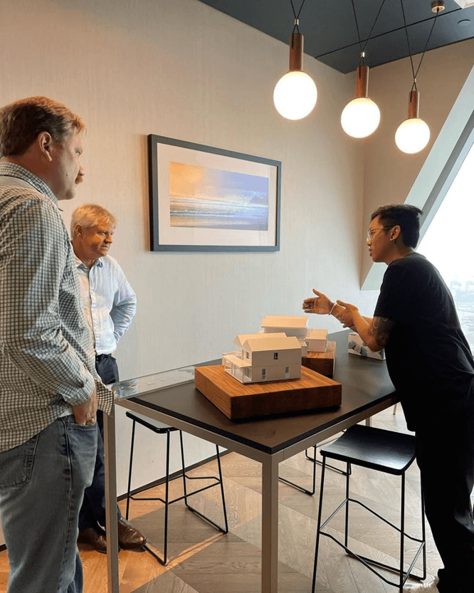Carl Salas presenting architectural models