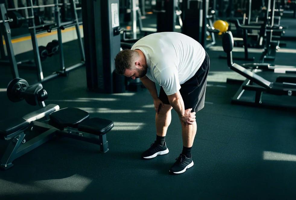 a man exercising in his big and tall athletic shorts and T-shirts