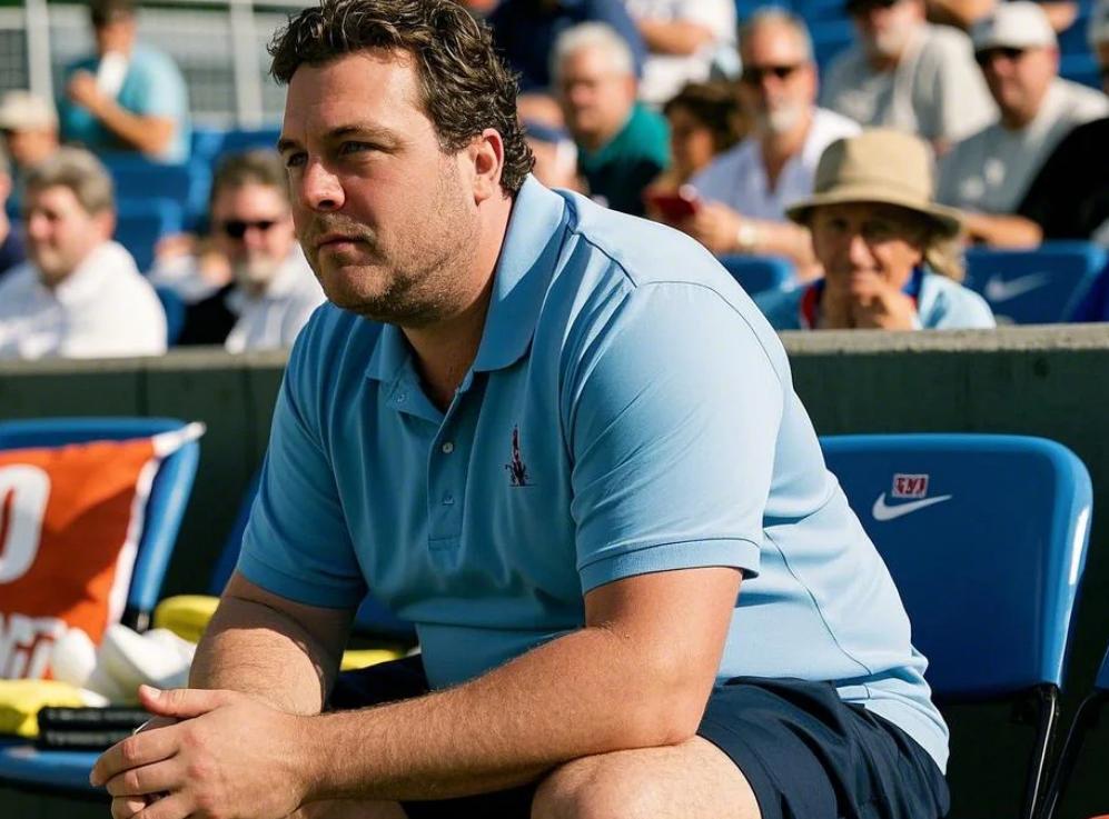 A man watching a match in his casual polo short set
