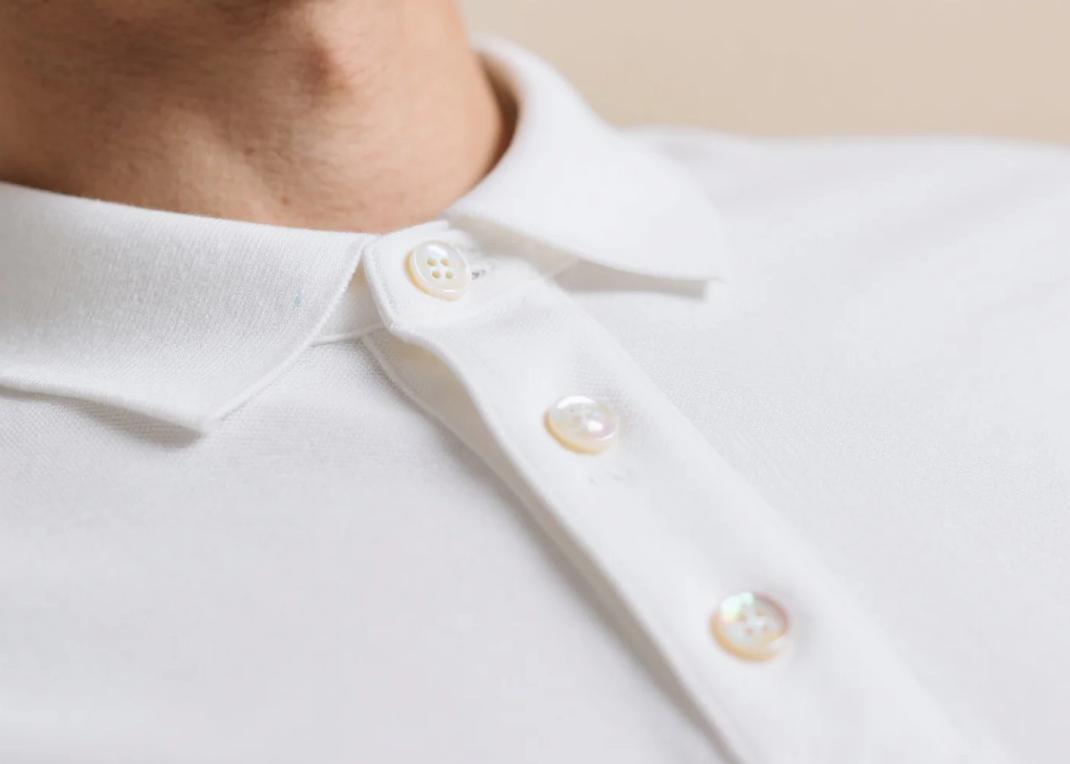 A polo shirt with mother-of-pearl buttons