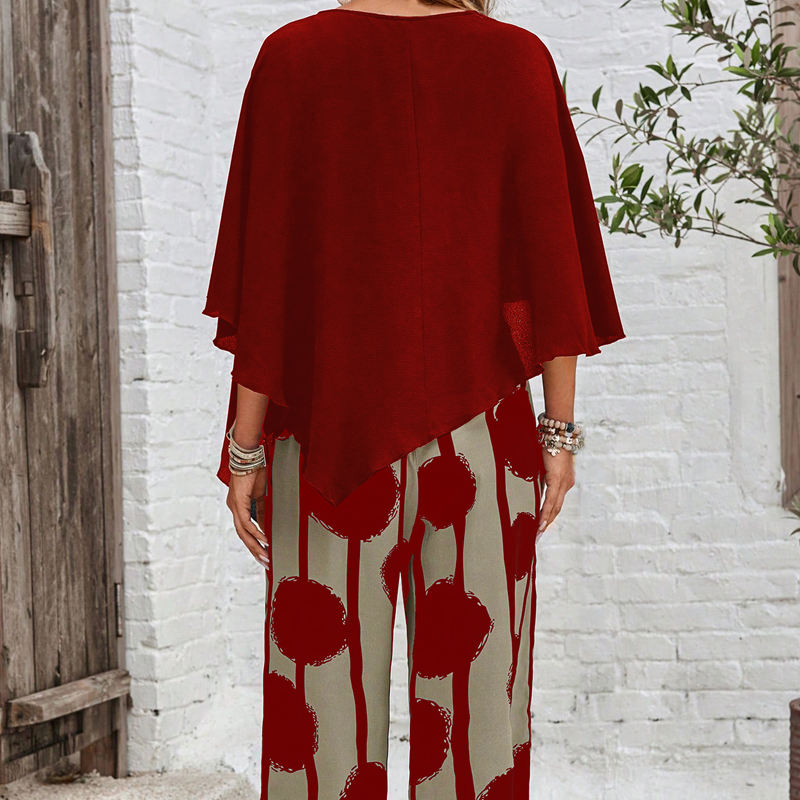 Elegant set with three-quarter sleeve blouse and patterned trousers