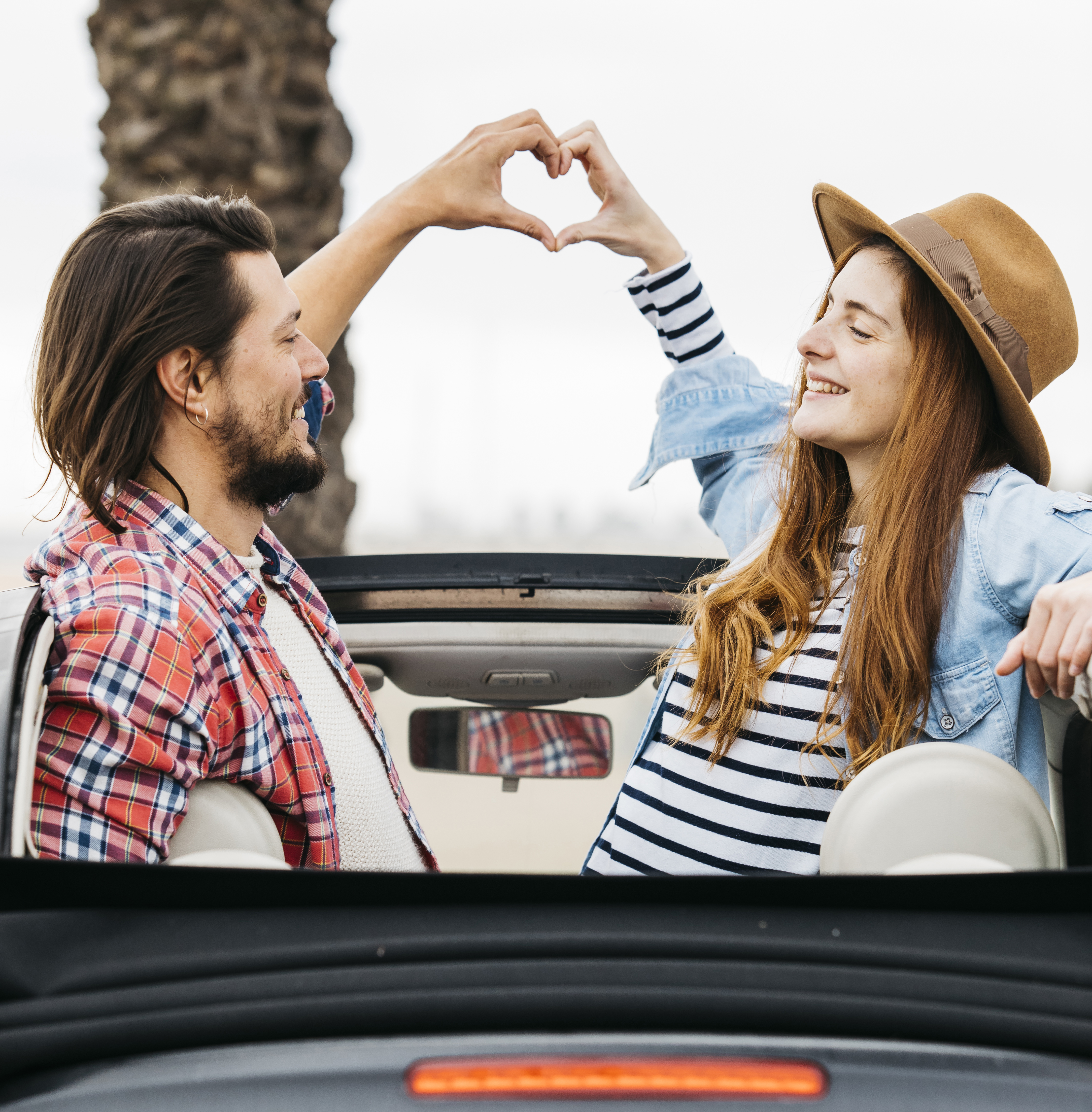 young couple on a car, loving each other. This website sells personalizzed gifts, jewerlys. This is the page of a keychain with sentimental words"Drive safe, I need you." customers can personalize their names on the keychain. The keychain is mainly for couples, wedding, anniversary.